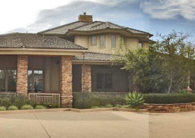 Panoramic view of a sprawling Craftsman style home with a grand peaked entrance in Temecula