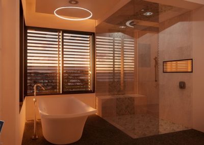 Contemporary bathroom with a halo style lighting fixture a freestanding tub and a glass enclosed shower